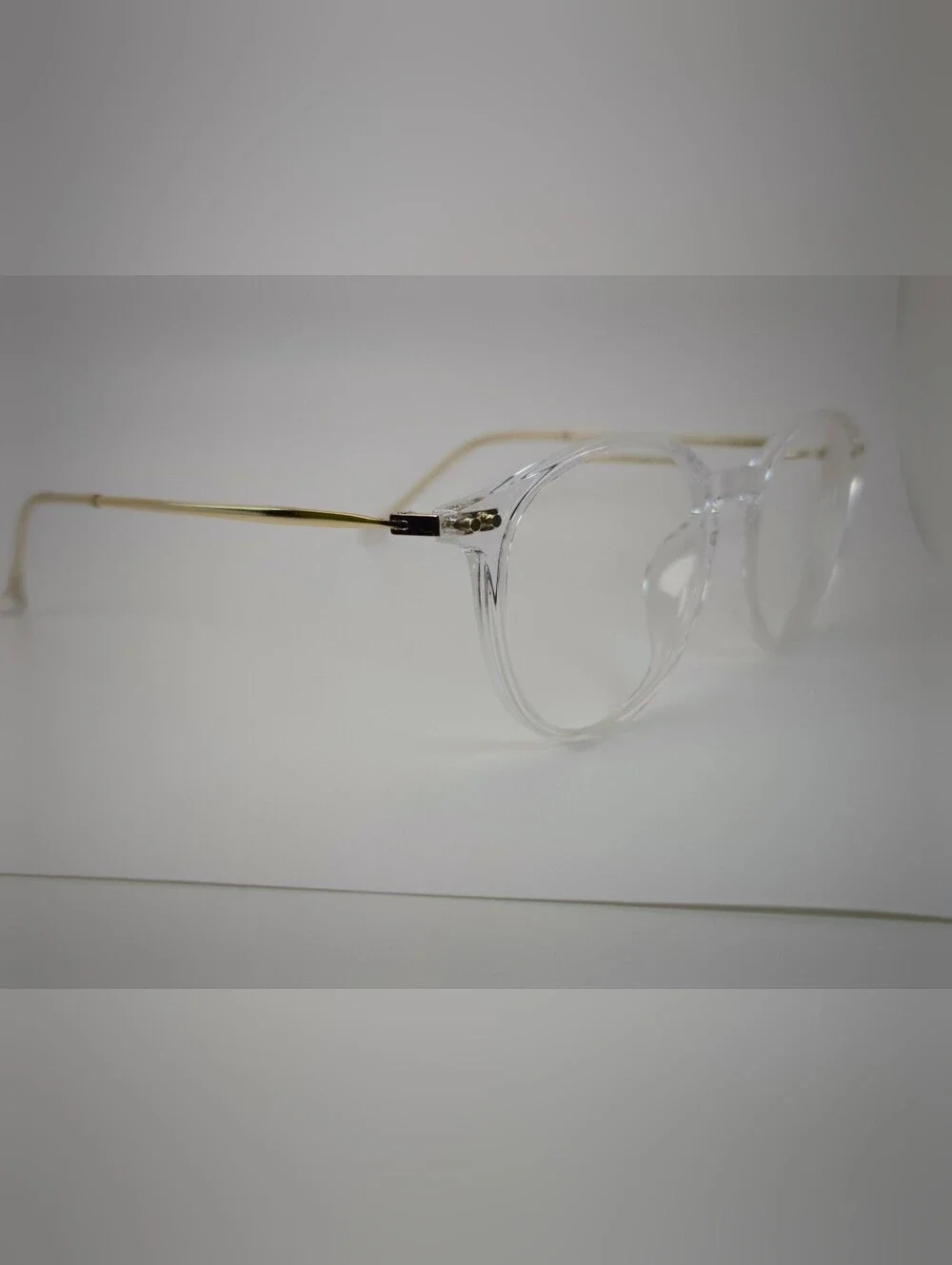 Amity. Clear Round Frame Glasses with Subtle Gold Temples. Opthalmic